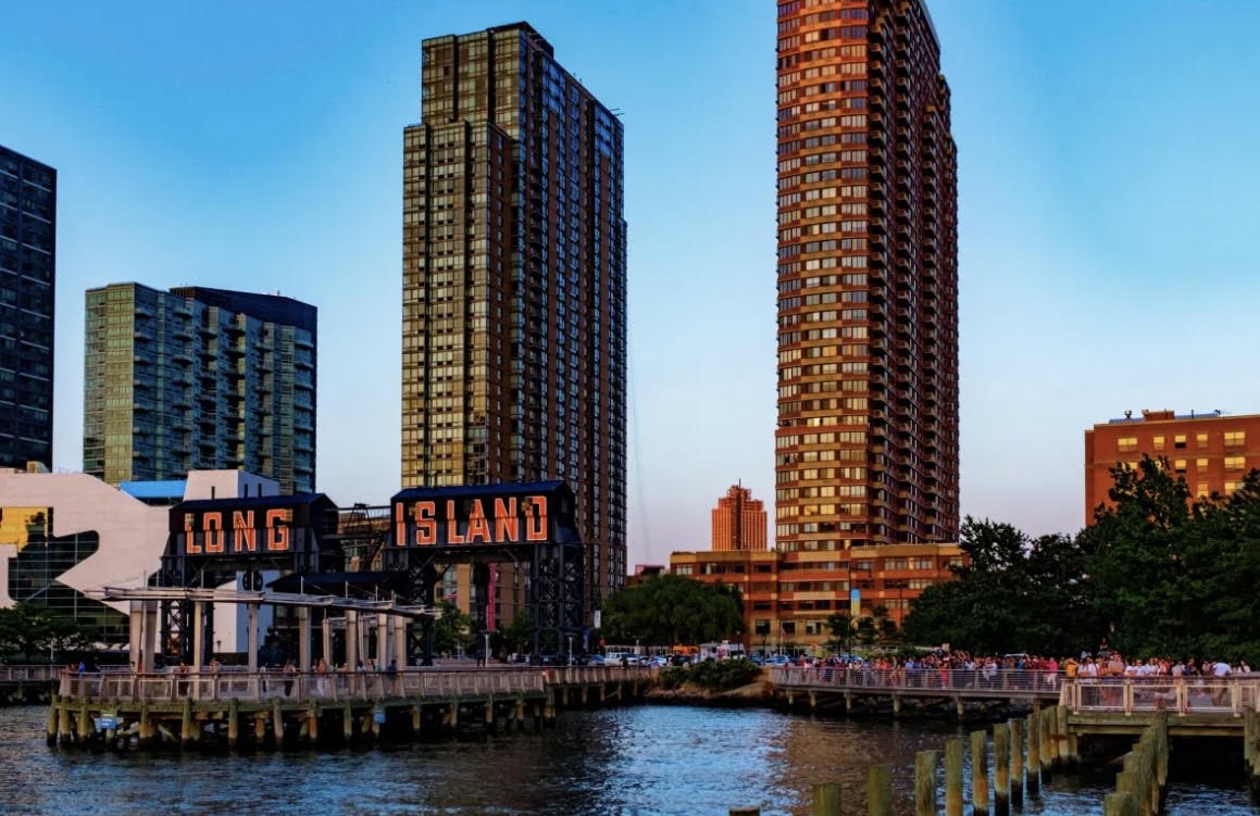The Long Island sign on the Long Island City waterfront at sunset
